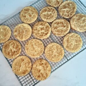 Snickerdoodle cookies cooling on rack